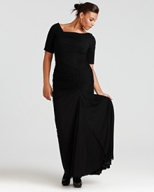 The off-shoulder cut of this Tadashi Shoji gown lends a suggestive tone to the beautifully timeless style.