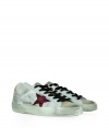 Modeled after vintage tennis shoes, this high-end version from Golden Goose will add an instant upgrade to your casual-cool style - Round suede toe, lace-up front, two-tone upper with side star detail, embossed leather logo detail at ankle, stylishly distressed rubber sole - Style with skinny jeans, a mini-skirt, or cut off denim shorts