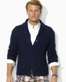 Cable-knit from plush cotton and cashmere yarns for lightweight warmth, this classic buttoned cardigan is handsomely updated with a shawl collar for sleek style.