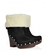 Show off your impeccable style while maintaining warmth and comfort in these wedge clogs with a cozy shearling cuff from UGG Australia - Round toe, platform, wooden wedge heel, stud-detailed trim, contrasting shearling cuff, adjustable back with D-ring buckle - Pair with skinny jeans, an oversized cashmere sweater, and a down jacket or wool cape