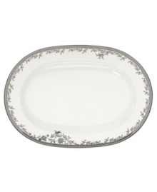 Pick the Hayden oval platter for pale blue florals and a lacy platinum border. Matching platinum bands add a traditional touch to glazed white for porcelain that shines in any setting. From Noritake's collection of serveware and serving dishes.