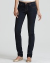 J Brand pencil leg jeans in ink are a slim fit pant with a 12 leg opening. Five pockets, brass hardware and orange stitching. Button and zipper closure and whiskering on front. Plain pockets on back.