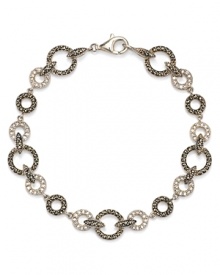 Crystal stones dress up this Judith Jack bracelet and offer a glamorous complement to its striking sterling silver setting.