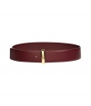 Cinch your look in luxe style with this lovely leather belt from Salvatore Ferragamo - Smooth leather with gold-tone buckle - Wear with a tie-neck blouse, a pencil skirt, and a long cardigan