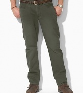 Casual pants tailored from sun-faded mid-weight chino, designed for authentic five-pocket styling and a straight leg. Standard-rise belted waist with Ralph Lauren's signature shank closure. Five-pocket jean styling with signature metal rivets. Flat-front with a timeworn, vintage feel.