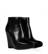 A sleek urbane staple guaranteed to give your look a kick of cool, these Kors Michael Kors leather booties are a chic choice no matter how you pair them - Softly pointed toe, inside zip, stacked leather platform sole unit - Ankle height - Wear with opaque tights and knit dresses or edgy leather leggings and chunky oversized pullovers