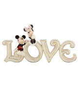 True love found. Minnie and Mickey Mouse share a special moment in this gold-banded porcelain figurine from Lenox. A sweet gift for your favorite Disney fan.