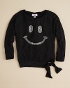 Tied jauntily to the side, this super sweet sweatshirt flaunts a rhinestone-studded smiley face and rolled neckline.