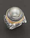 A bold, gleaming pearl and 18K gold detailing emphasize the beauty of intricately detailed sterling silver. By Konstantino.