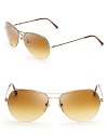 Tie up a head-to-toe Burberry look in these stylish aviator sunglasses, with subtle touches of signature plaid.