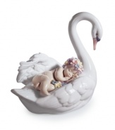 Mama swan takes a sleepy baby on the ride of her life in the fanciful Drifting Through Dreamland figurine, handcrafted in Lladro porcelain.