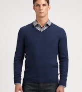 Slim-fitting, extra-fine virgin wool sweater with contrast color detail at inside collar trim.V-neckRibbed knit cuffs and hemWoolDry cleanImported