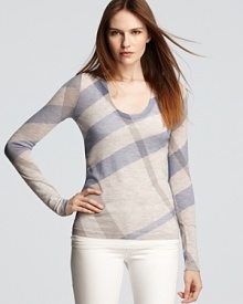 Burberry Brit's signature check print is splashed in bright blue on this cozy sweater from the experts on British cool.