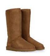 A tried-and-true cold weather staple, these tall classic shearling boots from UGG Australia boast comfort and utilitarian chic - Round toe, rugged rubber sole, exposed seams, cozy shearling lining, back logo detail - Tall shaft height - Pair with skinny jeans, an oversized cashmere sweater, and a down jacket or wool cape