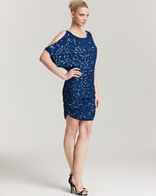 Split dolman sleeves add edge to this Aidan Mattox sequin dress, which needs nothing more than a pair of soaring metallic platforms.