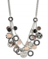 Nine West's shaky frontal necklace starts the night off right. The three-row design flaunts circular pendants in silver tone, hematite tone and rose-gold tones. Crafted in silver tone mixed metal. Approximate length: 18 inches + 2-inch extender. Approximate drop: 1-3/4 inches.