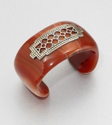 From the Dot Collection. This nature-inspired style from a socially and environmentally responsible brand features a stunning red agate cuff decorated with a delicate, sterling silver cutout center surrounded by a dotted 18k gold border. Red agateSterling silver18k goldDiameter, about 2.3Slip-on styleImported