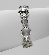 An unique and modern design featuring sterling silver spherical and circular links. Sterling silverToggle closureLength, about 7½Imported 