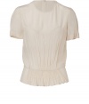 Elegant top in pure, ecru silk - Short, cuffed sleeves, round neck and back zip - Slim cut, billows slightly above hips before tapering - Gently pleated at chest and shoulders - Feminine and romantic, perfect for day or evening - Pair with a skinny jean or leather pencil skirt and platform pumps or ankle booties