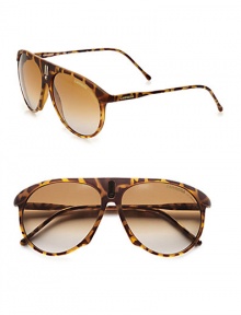 An unique style with a bridge accented with a sleek signature emblem. Available in blonde havana with brown/grey gradient lens. Logo temples100% UV protectionImported