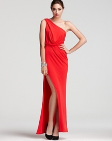 An eye-popping hue is tempered by elegant draping on this BCBGMAXAZRIA one-shoulder gown, finished with an alluring thigh-high slit.