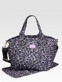 A floral printed style in lightweight nylon; perfect for toting around all your baby's essentials.Double top handles, 8½ dropDetachable adjustable shoulder strap, 17-24 dropTop zip closureFour outside open pocketsOne inside zip pocketTwo inside open pocketsOne changing padFully lined15½W X 13H X 6DImported