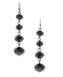 A refined line: With their long, lean silhouette, 2028's linear drop earrings epitomize elegance. Crafted in hematite tone mixed metal with black plastic beads. Approximate drop: 2 inches.