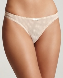 A mesh thong with scalloped edge trim in a raised dot print.