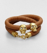 Two iconic, crystal accented skull beads on a luxurious, wrapped leather cord. Leather cordGoldtone brassCrystalsLength, about 14Lobster clasp closureMade in Italy