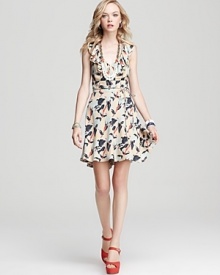 This Juicy Couture dress goes full-on feminine with decadent neckline ruffles and a playful iris print.