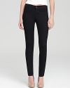 A minimalist design brings sleek sophistication to these inky-hued J Brand skinny pants.