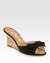 Natural cork wedge with a suede upper and bow adornment. Cork-covered wedge, 2¾ (70mm)Suede and natural cork upperBuffed leather soleMade in ItalyOUR FIT MODEL RECOMMENDS ordering one half size up as this style runs small. 