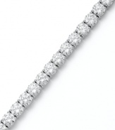 Match point. Arabella's stunning tennis bracelet combines dozens of round-cut Swarovski zirconias (31 ct. t.w.) in polished sterling silver. Approximate length: 7-1/2 inches.