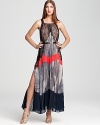 BCBGMAZARIA's trapeze-silhouetted gown lends a fashion-forward look with allover pleating, lace accents and a bright splash of contrasting color.