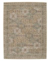 Imported from India, this magnificent rug presents a courtly style fit for today's most fashionable homes. Varying shades of green and beige are patterned in distinctive traditional design. Hand-tufted from ultra-soft 100% wool pile.