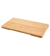 Regain lost counter space with this handy cutting board, crafted in bamboo wood to resist cuts marks and stand the test of time. Use it as a cutting board, trivet or serving tray with recessed side handles for easy movement. One-year limited warranty.