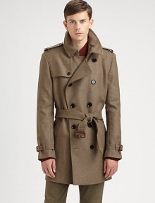 Featuring clever details and classic tailoring, a belted trenchcoat made from virgin wool.Notched collarGunflapButton closureBack yokeRainflapBack ventsAbout 35 from shoulder to hemVirgin woolDry cleanImported of Italian fabric