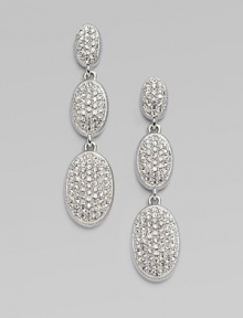 EXCLUSIVELY AT SAKS. From the Metropolitan Oval Collection. Three graceful ovals in graduated sizes are luxuriously paved with sparkling hand-set crystals. Crystal Rhodium plated Drop, about 1½ Post back Imported