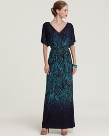 Infused with a ravishing print, this Trina Turk maxi dress in billowing silk is ideal for effortless day-to-night wear.