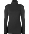 Ultra soft in cotton stretch, Vinces black turtleneck is a great way to ground your basics - Turtleneck, long sleeves - Long lean fit - Wear tucked into a pencil skirt with opaque tights and heels, or pile over layers on extra chilly days