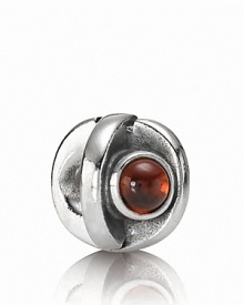 A sterling silver eye charm with garnet iris adds a blink of color to your PANDORA bracelet.