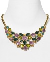 A statement making necklace crafted of luminous 12-karat gold plate, faceted gemstones in a dramatic color palette define this Carolee showpiece.