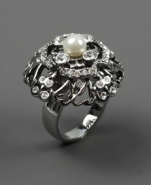 A single glass pearl steals the spotlight amidst glittering crystal embellishments on this ravishing cocktail ring from Givenchy. It's sure to stand out at your next special occasion. Made in silver tone mixed metal. Size 7.