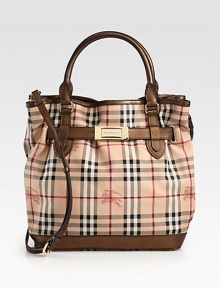 An iconic, haymarket check print on coated canvas accented with chic metallic leather trim and radiant hardware.Double leather top handles, 5½ dropDetachable adjustable leather shoulder strap, 20-22½ dropOpen topProtective metal feetThree inner compartmentsOne inside zip pocketTwo inside open pocketsCotton lining12W X 13H X 6½DImported