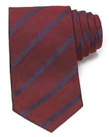 Maintain your polished appearance with this dignified silk tie, cut in a classic width for traditional appeal and patterned with a handsome stripe design.