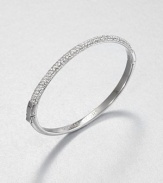 From the Brilliance Collection. Half of this graceful bangle is paved with sparkling rhinestones, the other half has a smooth, polished finish, with a handy hinge in between.GlassSilvertoneDiameter, about 2.5Hinged with push-lock claspImported