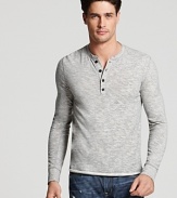 An elevated basic from Vince. This trim henley tee has a narrow button placket and allover heather texture.