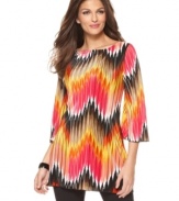 Bright zigzag stripes make a bold spring statement on this Alfani tunic -- perfect over the season's skinny jeans & leggings!