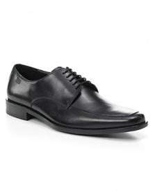 Square toe dress shoe with lace up front with top stitching detailing on front, rubber heel, slightly stacked.