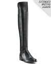 Sleek over-the-knee pull-on leather boots. Elasticized back for slip on ease. Round toe and 1 stacked heels. Rubber sole.